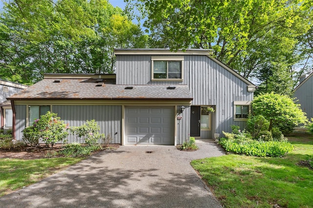 304 Heritage Hls Unit C, Somers, NY 10589 - view of front of house with asphalt driveway, a garage, and a shingled roof
