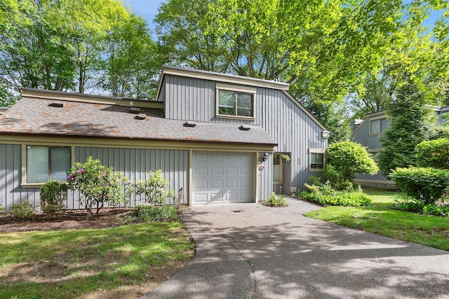 304 Heritage Hls Unit C, Somers, NY 10589 - view of front facade featuring asphalt driveway, an attached garage, and board and batten siding