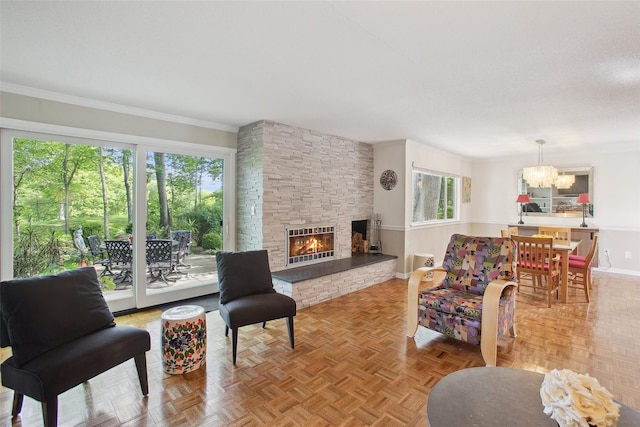 304 Heritage Hls Unit C, Somers, NY 10589 - living area featuring a chandelier, baseboards, a stone fireplace, and ornamental molding