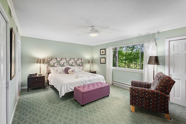 304 Heritage Hls Unit C, Somers, NY 10589 - bedroom featuring a baseboard heating unit, ornamental molding, carpet floors, a textured ceiling, and ceiling fan