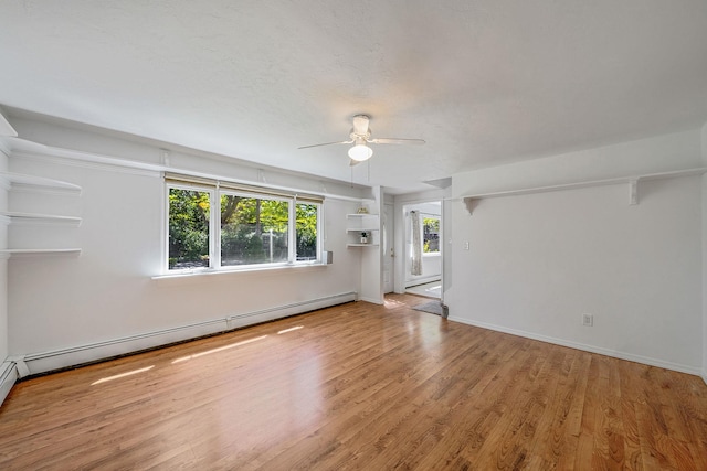 218 Beaver Dr, Mastic Beach, NY 11951 - unfurnished room with ceiling fan, wood finished floors, a baseboard radiator, and baseboards