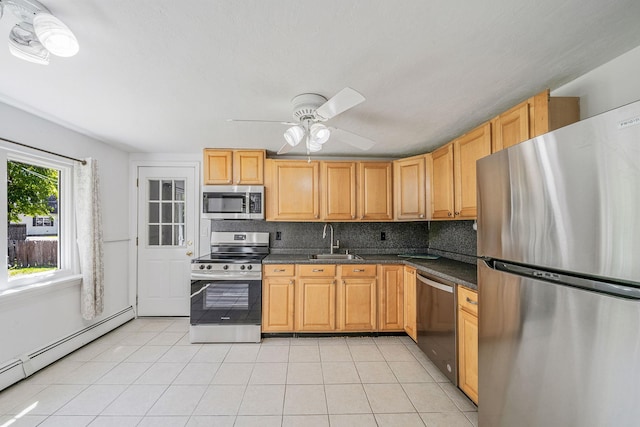 218 Beaver Dr, Mastic Beach, NY 11951 - kitchen featuring stainless steel appliances, a baseboard heating unit, a sink, decorative backsplash, and light tile patterned flooring