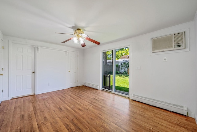 218 Beaver Dr, Mastic Beach, NY 11951 - unfurnished bedroom with a baseboard heating unit, access to exterior, light wood-style floors, and a wall mounted AC