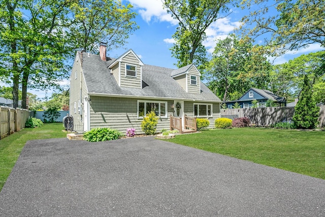 218 Beaver Dr, Mastic Beach, NY 11951 - cape cod house with a chimney and roof with shingles