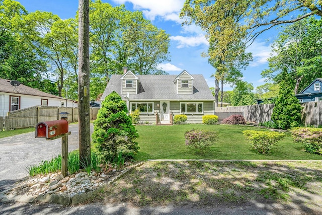 218 Beaver Dr, Mastic Beach, NY 11951 - new england style home featuring a chimney