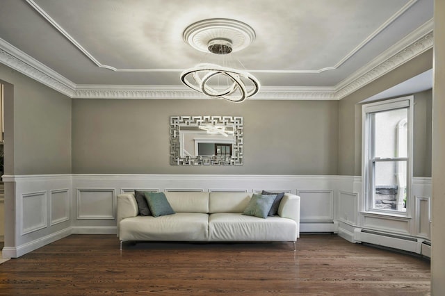 2 Maize Ct, Melville, NY 11747 - living area featuring a baseboard radiator, wood finished floors, a chandelier, a wainscoted wall, and a decorative wall