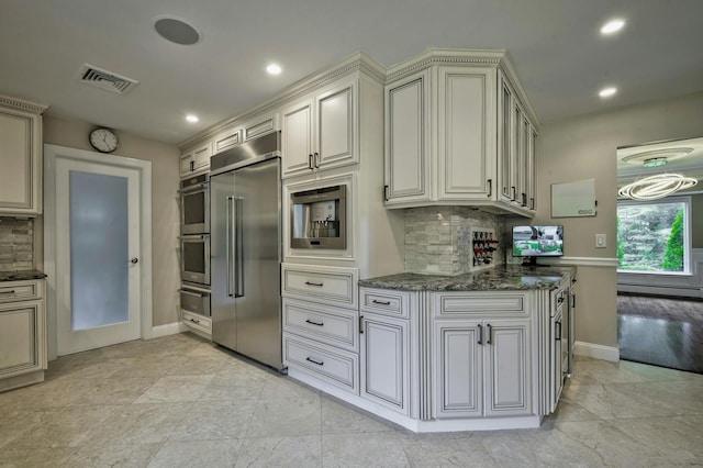 2 Maize Ct, Melville, NY 11747 - kitchen featuring stainless steel appliances, a warming drawer, baseboards, backsplash, and recessed lighting