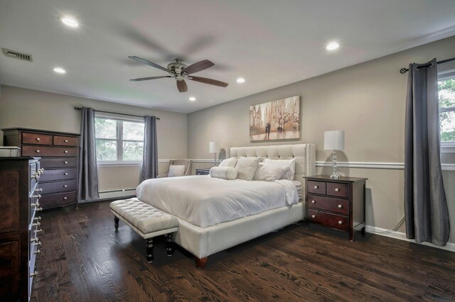 2 Maize Ct, Melville, NY 11747 - bedroom featuring dark wood-style flooring, multiple windows, recessed lighting, baseboard heating, and ceiling fan
