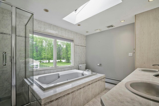 2 Maize Ct, Melville, NY 11747 - full bath featuring a skylight, a whirlpool tub, a baseboard radiator, a stall shower, and double vanity