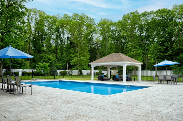 2 Maize Ct, Melville, NY 11747 - view of swimming pool featuring a gazebo, an outdoor living space, a patio, and view of wooded area