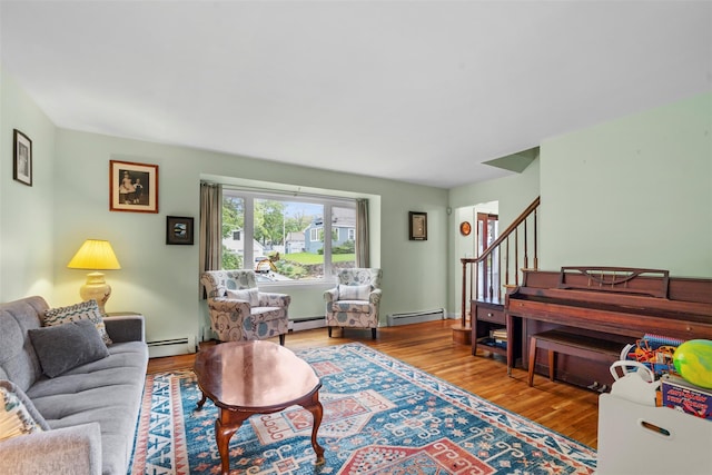 1A Ward St, Suffern, NY 10901 - living room featuring a baseboard radiator, wood finished floors, and stairs