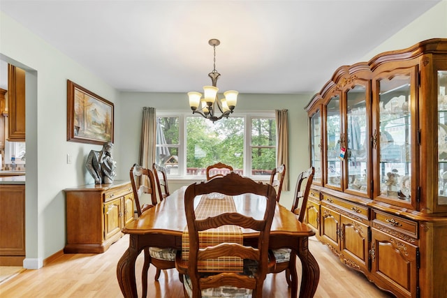 1A Ward St, Suffern, NY 10901 - dining space with a chandelier, light wood-type flooring, and baseboards