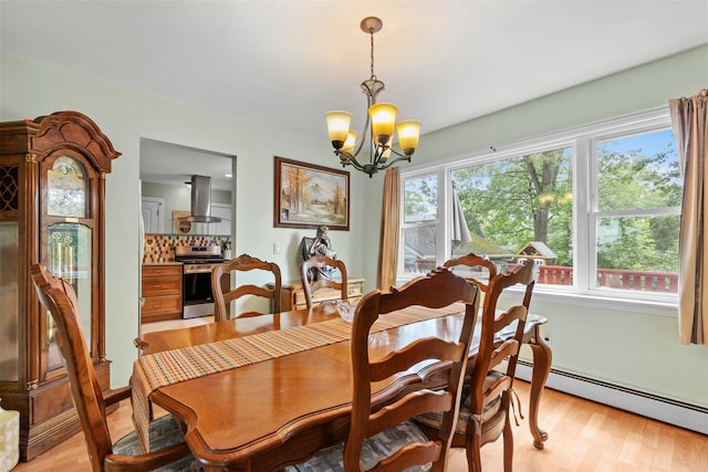 1A Ward St, Suffern, NY 10901 - dining space with a chandelier, light wood-type flooring, and baseboard heating