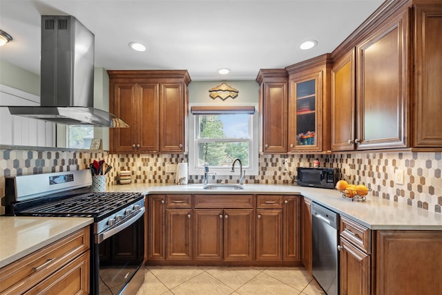 1A Ward St, Suffern, NY 10901 - kitchen featuring wall chimney range hood, stainless steel appliances, a sink, light tile patterned floors, and light countertops