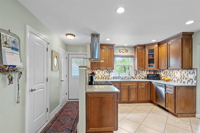 1A Ward St, Suffern, NY 10901 - kitchen featuring stainless steel appliances, island range hood, brown cabinets, light countertops, and backsplash