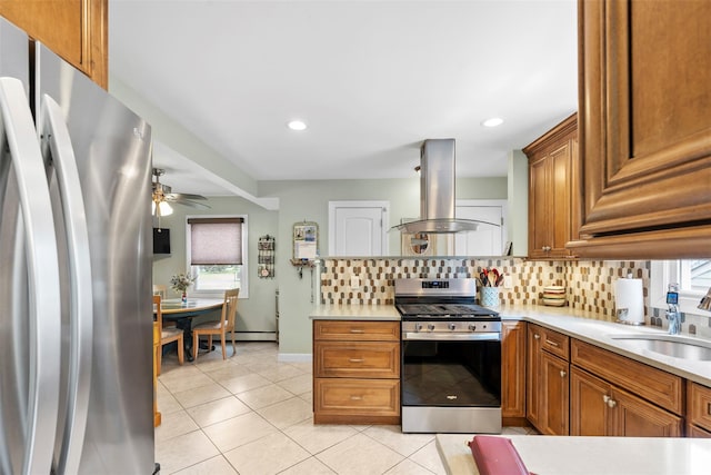 1A Ward St, Suffern, NY 10901 - kitchen featuring stainless steel appliances, island range hood, a sink, decorative backsplash, and brown cabinetry