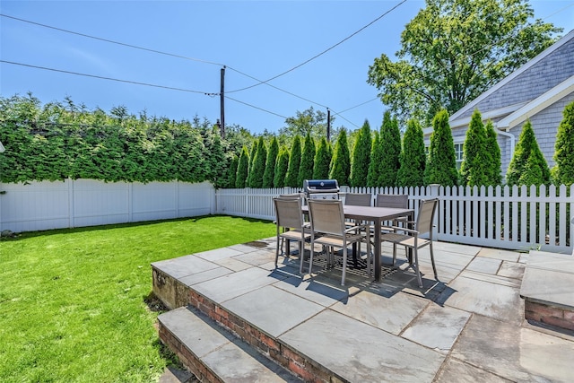 11 Spruce St, Garden City, NY 11530 - fenced backyard featuring a patio area and outdoor dining space