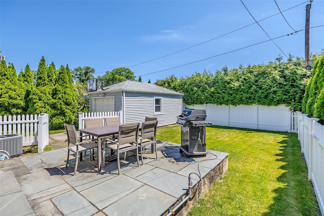11 Spruce St, Garden City, NY 11530 - fenced backyard with a grill, a patio, an outbuilding, and outdoor dining area