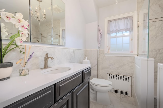 11 Spruce St, Garden City, NY 11530 - bathroom with radiator, tile walls, marble look tiles, vanity, and a shower