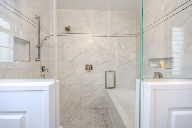11 Spruce St, Garden City, NY 11530 - bathroom featuring a tile shower and a tub