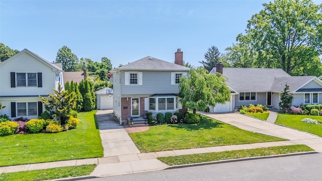 11 Spruce St, Garden City, NY 11530 - view of front facade featuring driveway, a garage, a chimney, a front lawn, and brick siding