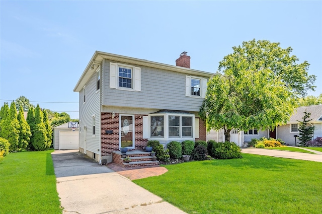 11 Spruce St, Garden City, NY 11530 - colonial home featuring an outbuilding, a chimney, a front yard, a detached garage, and brick siding