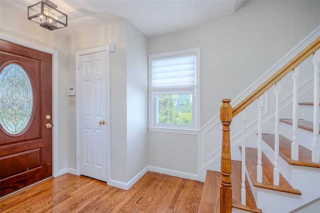 11 Spruce St, Garden City, NY 11530 - entryway featuring light wood-style floors and stairs