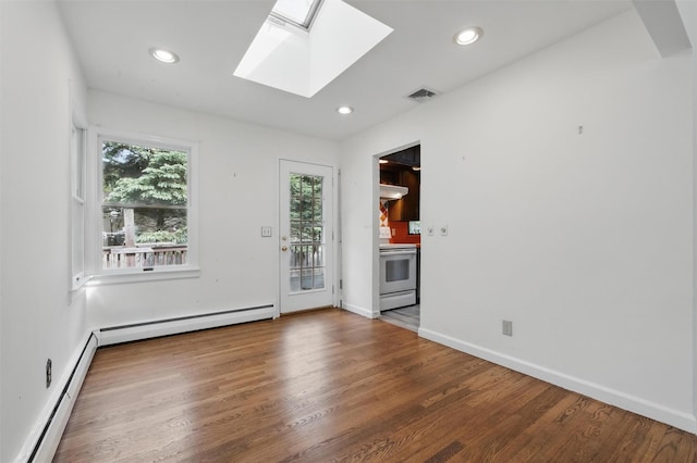 55 Stephanie Ln, Poughkeepsie, NY 12603 - empty room featuring a skylight, wood finished floors, recessed lighting, baseboards, and a baseboard radiator