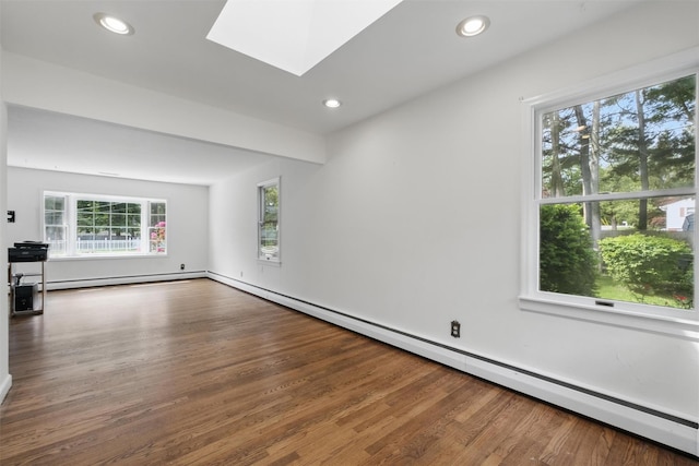 55 Stephanie Ln, Poughkeepsie, NY 12603 - spare room with a baseboard radiator, wood finished floors, a baseboard heating unit, a skylight, and recessed lighting