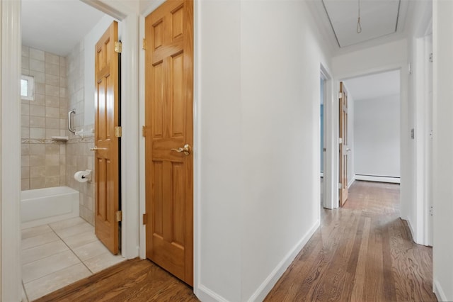 55 Stephanie Ln, Poughkeepsie, NY 12603 - corridor featuring a baseboard radiator, attic access, and wood finished floors