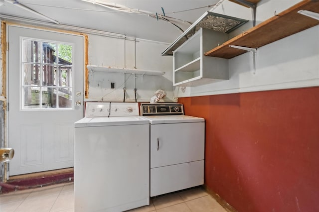 55 Stephanie Ln, Poughkeepsie, NY 12603 - laundry area featuring washing machine and dryer, light tile patterned flooring, and baseboards