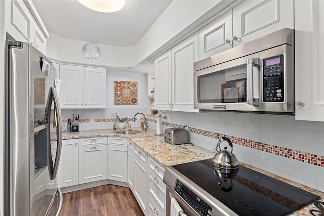 50 Popham Rd Unit 4E, Scarsdale, NY 10583 - kitchen featuring appliances with stainless steel finishes, a sink, and white cabinetry