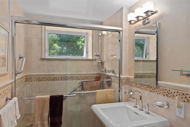 50 Popham Rd Unit 4E, Scarsdale, NY 10583 - full bath with plenty of natural light, tile walls, a sink, and a stall shower