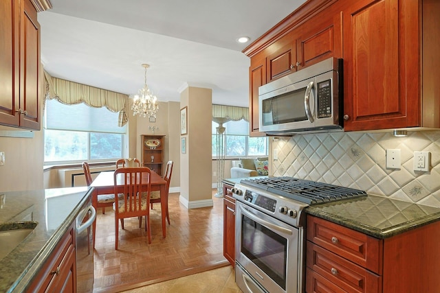 1270 N Ave Unit 3A, New Rochelle, NY 10804 - kitchen featuring stainless steel appliances, a chandelier, tasteful backsplash, baseboards, and recessed lighting