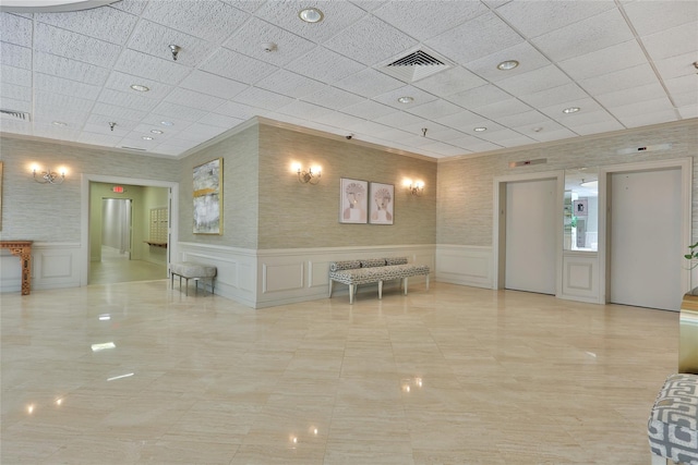 1270 N Ave Unit 3A, New Rochelle, NY 10804 - common area featuring a decorative wall, a paneled ceiling, and a wainscoted wall