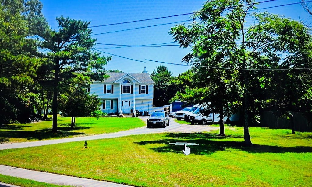 241 Middle Island Rd, Medford, NY 11763 - view of green lawn featuring driveway