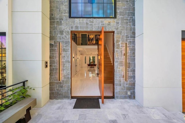 50 Gristmill Ln, Great Neck, NY 11023 - view of exterior entry featuring stone siding