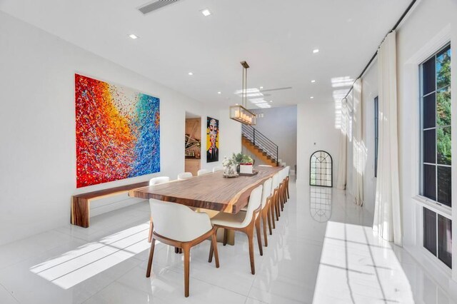 50 Gristmill Ln, Great Neck, NY 11023 - dining space with recessed lighting, stairway, and light tile patterned floors