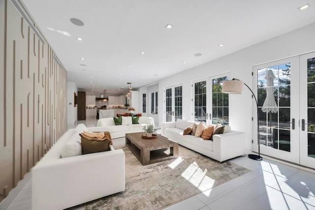 50 Gristmill Ln, Great Neck, NY 11023 - living room with french doors, light tile patterned floors, and recessed lighting