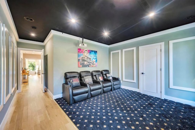 50 Gristmill Ln, Great Neck, NY 11023 - home theater featuring ornamental molding, baseboards, and wood finished floors
