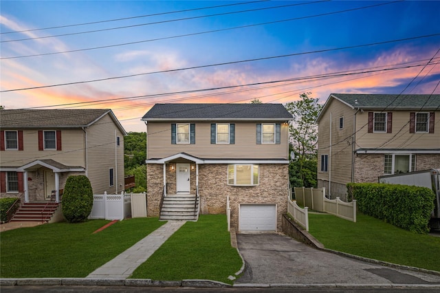 56 Patmore Ave, Yonkers, NY 10710 - view of front of house featuring driveway, an attached garage, and brick siding