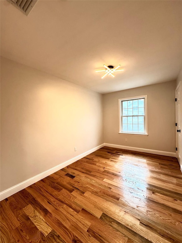 56 Patmore Ave, Yonkers, NY 10710 - unfurnished room featuring baseboards and wood finished floors