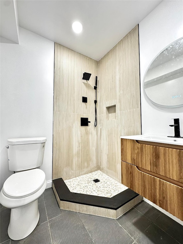 56 Patmore Ave, Yonkers, NY 10710 - bathroom featuring toilet, vanity, a stall shower, tile patterned flooring, and baseboards