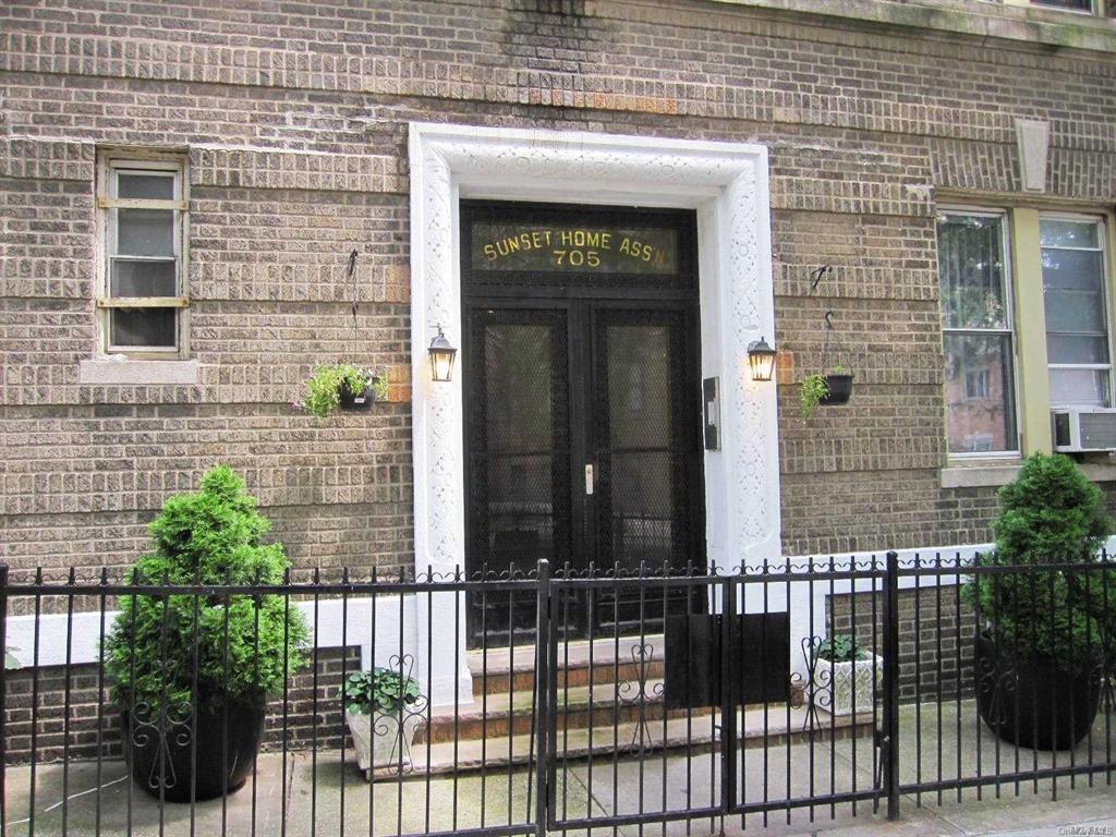 705 41st St Unit 7, Brooklyn, NY 11232 - property entrance featuring brick siding
