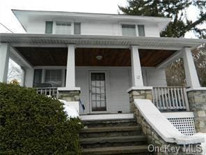 12 S Plank Rd, Newburgh, NY 12550 - view of front of house featuring covered porch and stone siding