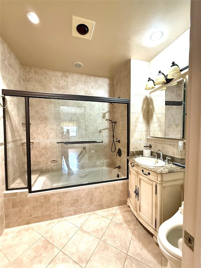 1 Overlook Ave Unit 1L, Great Neck, NY 11021 - bathroom with tile patterned floors, tiled shower / bath combo, vanity, and recessed lighting