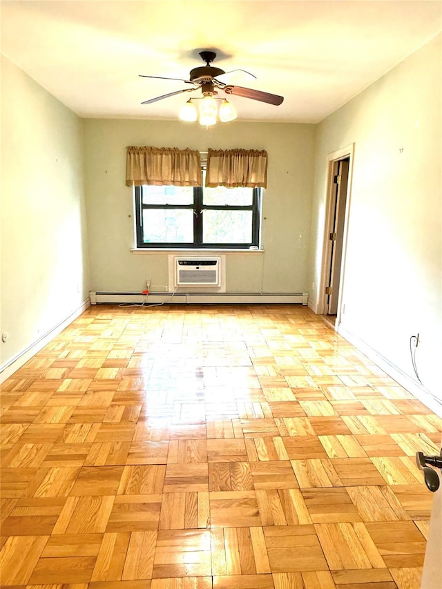 1 Overlook Ave Unit 1L, Great Neck, NY 11021 - spare room featuring a ceiling fan, a wall mounted air conditioner, and baseboards