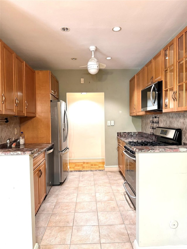 1 Overlook Ave Unit 1L, Great Neck, NY 11021 - kitchen featuring appliances with stainless steel finishes, tasteful backsplash, glass insert cabinets, ceiling fan, and recessed lighting