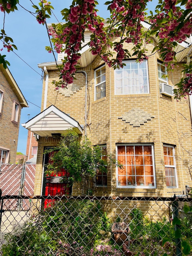 8439 130th St, Kew Gardens, NY 11415 - view of front of house featuring brick siding and cooling unit