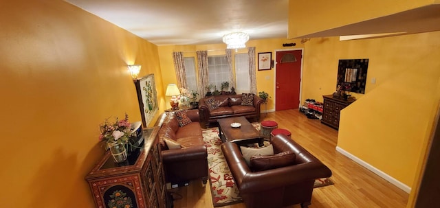 8439 130th St, Kew Gardens, NY 11415 - living area featuring wood finished floors and baseboards